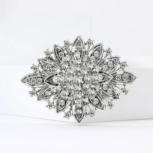 Elegant vintage silver snowflake brooch with sparkling rhinestones for bridal accessories
