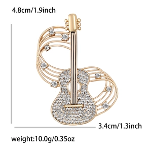 Fashionable golden guitar brooch with sparkling rhinestones and musical score design