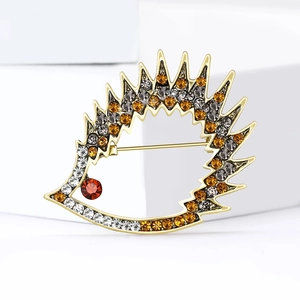 Cute retro hedgehog brooch with amber and gray rhinestones on a gold alloy setting