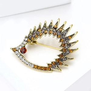 Macro detail of hedgehog brooch with vintage gold alloy and sparkling rhinestones