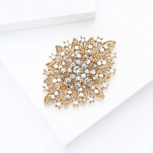 Detailed macro view of a layered sunflower brooch with sparkling rhinestones and gold alloy