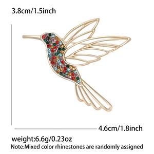 Detailed view of hummingbird brooch with colorful rhinestones and size dimensions