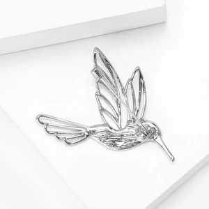 Detail of S925 silver hummingbird brooch with engraved feathers and back pin structure