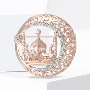 Vintage rose gold Taj Mahal crescent brooch with rhinestones for elegant sweaters