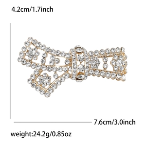 Elegant gold alloy bow brooch with white crystal rhinestones and hollow floral design
