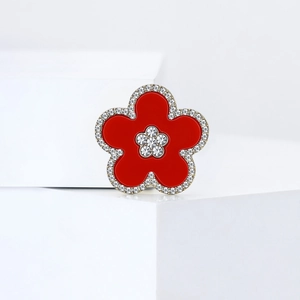 Elegant red five-petal flower brooch with sparkling white rhinestones on golden base