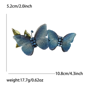 Elegant blue fabric butterfly hair clip with crystal beads and metal leaves