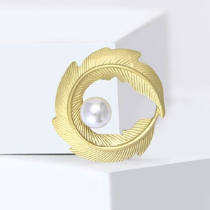 Minimalist gold matte leaf brooch featuring a brushed texture and an elegant white pearl
