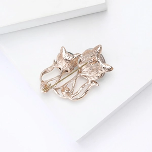 Macro shot of rose gold cat brooch back showing texture and sturdy safety pin clasp