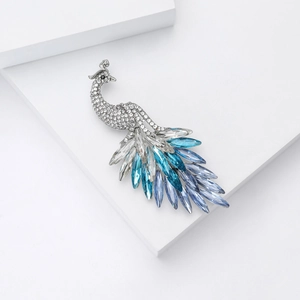 Macro detail of elegant peacock brooch with multicolor crystals and shimmering rhinestones