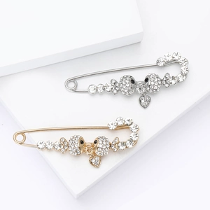 Elegant rhinestone fish skull safety pin brooches in gold and silver with heart charms