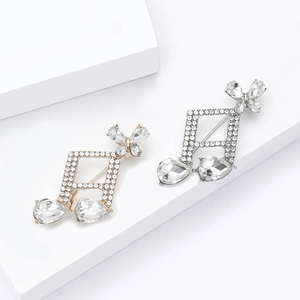 Broches élégantes en forme de notes de musique, dorées et argentées avec strass