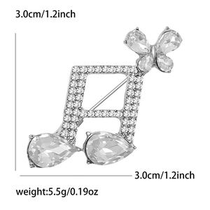 Détail montrant les dimensions 3x3 cm et le poids de la broche note en strass argenté