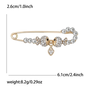 Golden alloy twin fish brooch with rhinestones and heart pendant, size 6.1cm by 2.6cm
