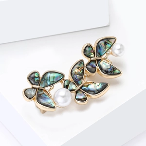 Elegant butterfly brooch with abalone shell wings and white pearls on gold plating