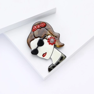 Pop art acrylic brooch of a girl with sunglasses, red bow, and leopard collar accessory