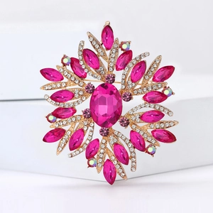 Macro shot of luxury pink crystal floral brooch with rhinestones on a white stand