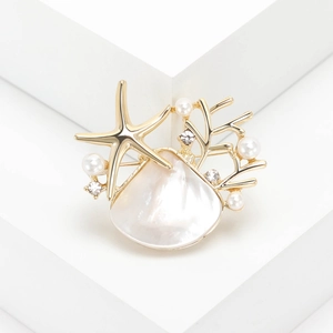 Fashion gold alloy starfish shell brooch with pearls and crystals on white blocks