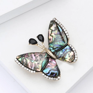 Broche papillon élégante avec ailes en nacre d'abalone et strass brillants sertis