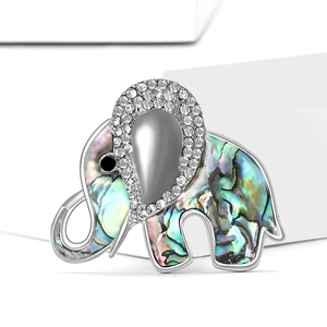 Elegant silver elephant brooch with iridescent abalone shell and sparkling crystals