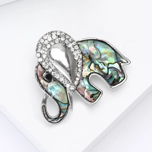 Elegant silver elephant brooch with colorful abalone shell and sparkling white rhinestones