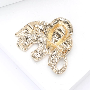 Detail view of golden elephant brooch back with safe rotating pin clasp structure