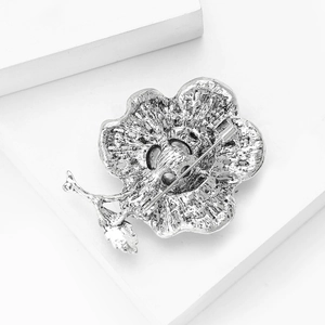 Detailed macro view of the alloy flower brooch back showing the pin closure mechanism