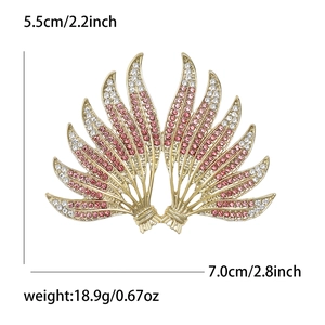 Elegant gold alloy wing brooch with pink and white rhinestones and product dimensions