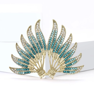 Elegant gold-tone alloy brooch with blue and clear rhinestones in feather wing design