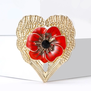 Exquisite gold heart brooch with a red enamel poppy flower and sparkling black gemstone