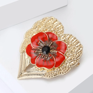 Exquisite gold alloy heart brooch featuring a red enamel flower with a black center gemstone