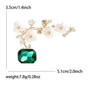 Elegant plum blossom plant brooch with emerald gemstone and crystals in gold finish