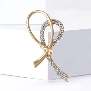 Elegant gold-tone alloy bowknot brooch featuring shimmering white crystal rhinestones