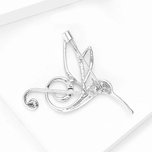 Detailed back view of hummingbird brooch showing secure silver metal pin clasp and craftsmanship