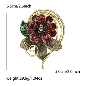 Vintage alloy flower brooch with red enamel and gold metallic leaf details