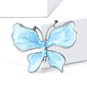 Spilla a farfalla elegante in argento con ali in smalto azzurro e cristalli luminosi