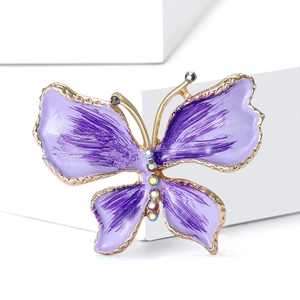 Spilla farfalla in smalto viola con cornice dorata e cristalli aurora scintillanti
