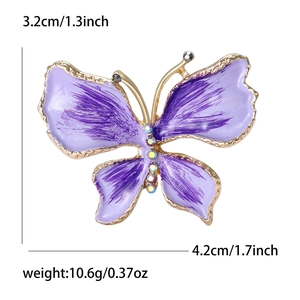 Spilla a farfalla in smalto viola con bordi dorati e gemme colorate larga 4,2 cm