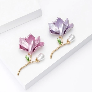Elegant enamel magnolia flower brooches with white pearls in pink and purple colors