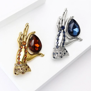 Vintage retro style hand-shaped brooches with colorful rhinestones in gold and silver finish