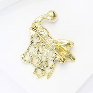 Detail view of the gold-plated pin back with heart cutout and sturdy needle clasp