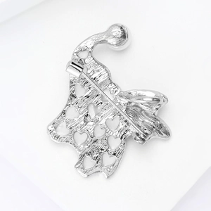 Detailed back view of silver elephant brooch featuring heart-shaped hollow metal design