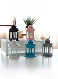 Detail of vintage hollow iron Christmas lanterns in five colors with star cutouts