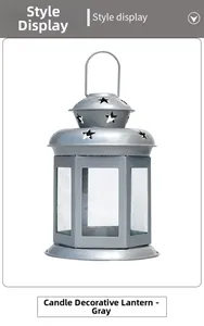 Macro detail of a grey hexagonal iron candle lantern with star-shaped cutout decorations