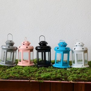 Christmas iron lanterns set in five colors with star cutouts and glass window panes