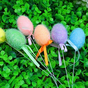 Colorful Easter egg picks with glitter fibers and silk ribbons for floral arrangements