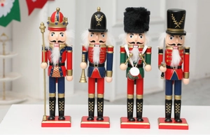 Detailed set of four traditional wooden Christmas nutcracker soldiers in classic uniforms