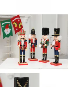 Set of four traditional wooden Christmas nutcracker soldiers on a festive white table
