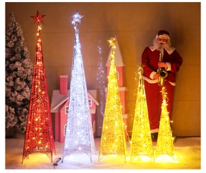 Detailed macro view of lighted metal wire Christmas tree pyramid cones with LED stars
