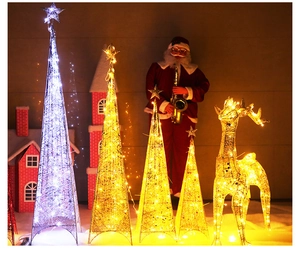 Detail of wrought iron LED Christmas cone trees and reindeer with warm and cold white lights